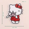 Cartoon cat embroidered iron-on patch with a 6.5 by 7.5 cm size guide and 1.5 g weight label.